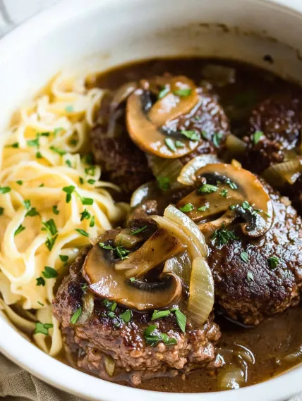 A bowl of beef and mushrooms.