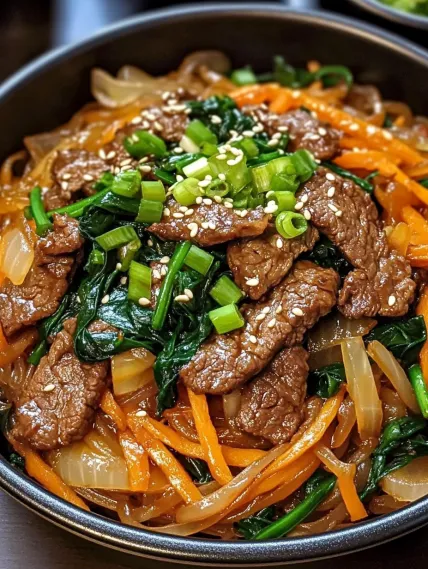 A bowl of beef and vegetables.