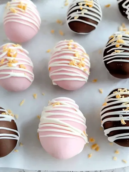 A pink and white candy with a white swirl.