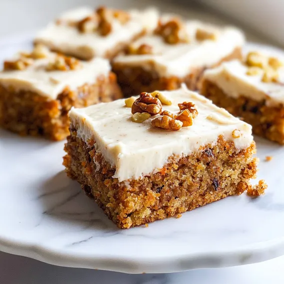 A cake slice topped with nuts.