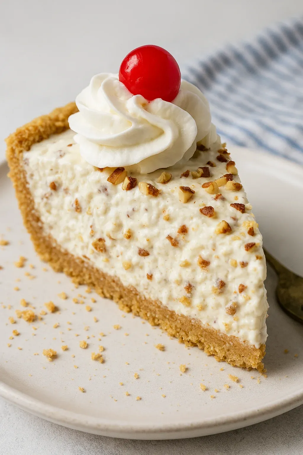 A slice of pie with whipped cream on top.